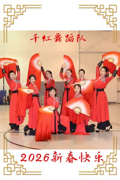 A student performing a fan dance on stage.