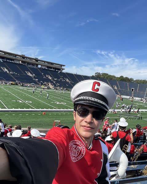 A student at a college football stadium.
